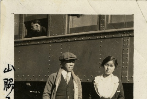 Issei couple at the train station (ddr-densho-113-54)