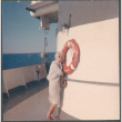 Agnes Sakura by life ring on deck of ship crossing Lake Michigan (ddr-densho-523-455)