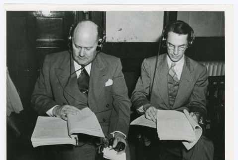 Charles Martin and Edward C. Reischauer reading the case against Japanese war criminals (ddr-densho-1007-404)