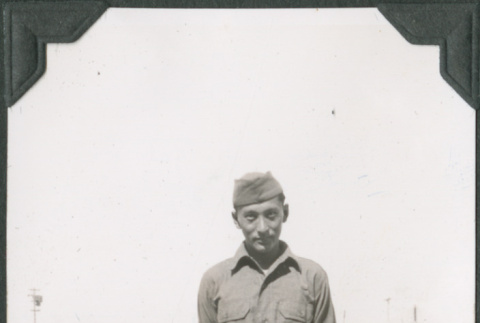 Man in uniform standing on road (ddr-ajah-2-71)