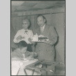 Agnes and Chester Sakura holding a cake (ddr-densho-523-283)
