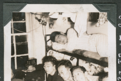 7 men sitting around radio (ddr-densho-540-50)