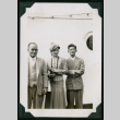 Two men and one woman pose aboard ship (ddr-densho-359-1055)