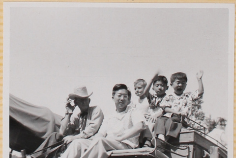 Hardy Shiomi with three boys and wagon driver on covered wagon (ddr-densho-522-319)