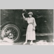 Young woman in front of a car (ddr-densho-353-214)