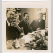 Three men seated at table with plates of food (ddr-densho-426-1700)