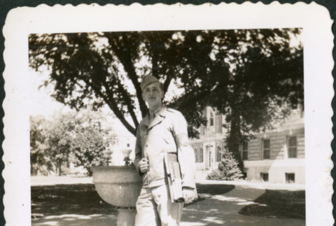 Man standing by drinking fountain (ddr-densho-434-457)