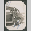 Pat poses next to a car (ddr-densho-463-78)