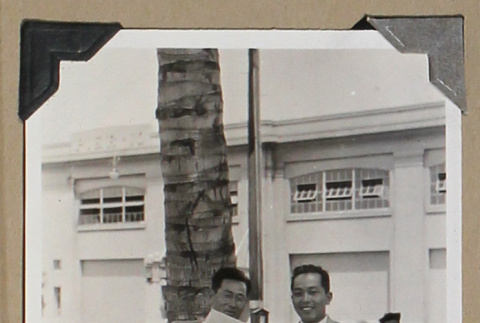 Two men holding multiple parcels (ddr-densho-404-265)