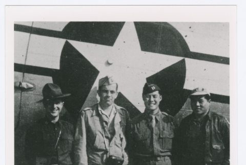 Four servicepeople with plane at Myitkyina Airfield (ddr-densho-1007-130)