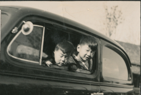 Two children in car (ddr-densho-523-117)
