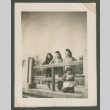 Three women and a child along a bridge (ddr-densho-550-280)