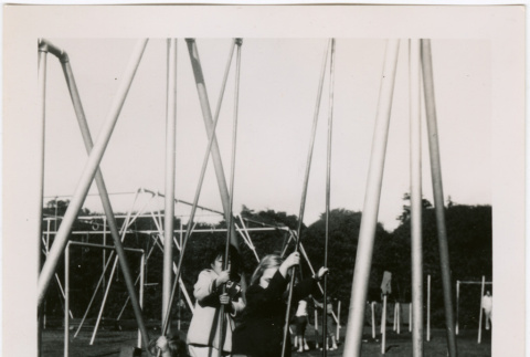 Children on swings at a park (ddr-densho-426-2466)