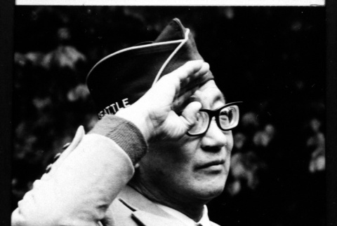 Serviceperson with glasses saluting (ddr-densho-1007-43)