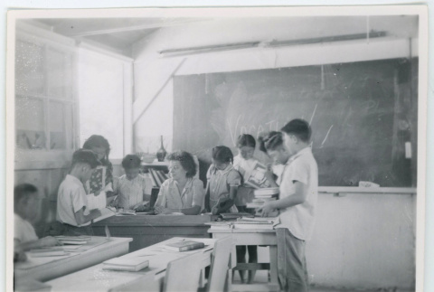 Students check in their books (ddr-densho-37-2120)