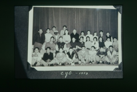 (Slide) - Image of young men and women seated around priest (ddr-densho-330-30-master-c7da3e79a1)