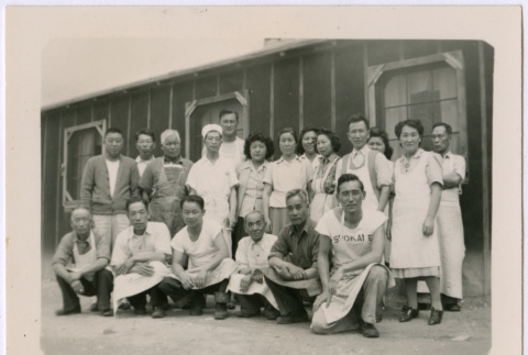Japanese American men and women wear aprons/ uniforms (ddr-densho-362-6)