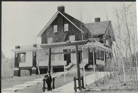 Man standing in front of house (ddr-densho-355-597)