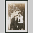 boy and girl next to fence (ddr-densho-378-779)