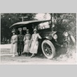 Four women standing with a car (ddr-densho-353-200)