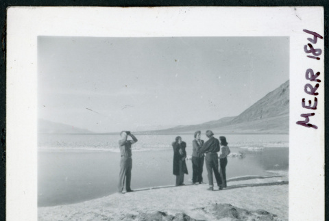 Photograph of L. Josephine Hawes and Theo Chamberlain in front of standing water at Bad Water in Death Valley (ddr-csujad-47-101)