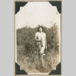 Woman standing in tall grass (ddr-densho-383-240)