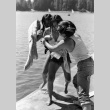 Pushing Julie Oji in the lake (ddr-densho-336-584)