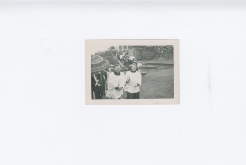 (Photograph) - Image of two priests and crowd outside Maryknoll (ddr-densho-330-286-master-8ea4656c02)