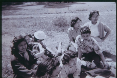 Women sitting on grass (ddr-densho-330-195)