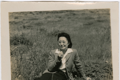 Woman sitting in field (ddr-densho-426-1938)