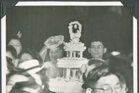 The bride and groom behind their wedding cake (ddr-densho-300-238)