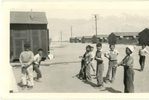Group of boys playing outside (ddr-manz-7-131)