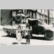 Two little girls posing in front of a parade float (ddr-densho-353-327)