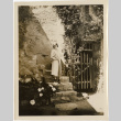 Tomoye (Nozawa) Takahashi standing on stone steps (ddr-densho-426-1789)