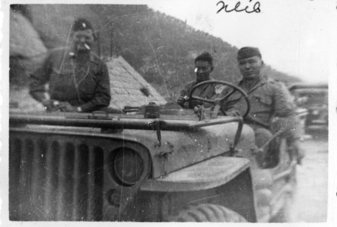 [Men in military uniform with military vehicle] (ddr-csujad-1-13)
