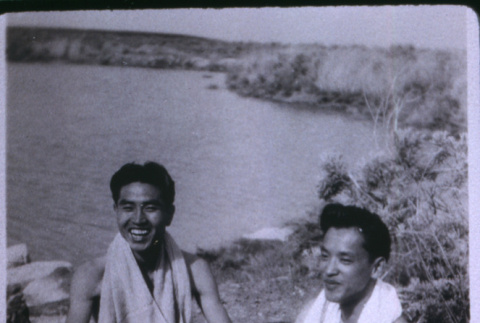 Two men with dog at pond (ddr-densho-1007-657)