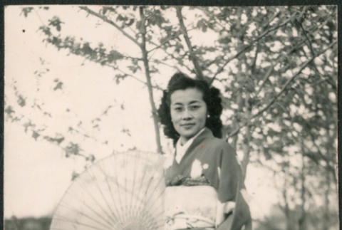 Woman in kimono with parasol (ddr-densho-523-221)