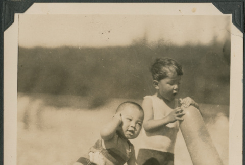 Two children playing on beach (ddr-densho-483-506)