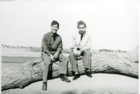 Two soldiers on a log (ddr-densho-1007-728)