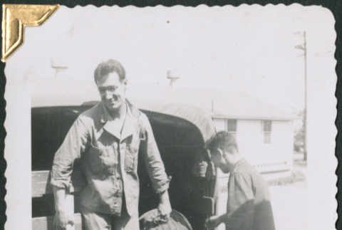 Two men unloading truck (ddr-densho-434-193)