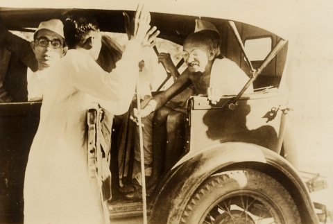 Gandhi riding in a car (ddr-njpa-1-444)