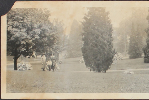 Two women and a boy in a park (ddr-densho-278-93)