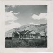 View of a house with mountains in the distance (ddr-densho-338-290)