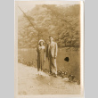 Man and woman standing by river (ddr-densho-426-1529)