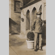 Soldier in front of brick building (ddr-janm-17-51)