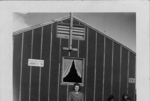 Evelyn Dell in front of school building (ddr-densho-152-3)