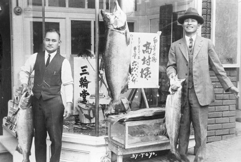 Two Issei men outside the Mitsuwado store (ddr-densho-13-16)