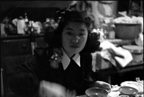 Tomoye (Nozawa) Takahashi at table eating (ddr-densho-426-1699)