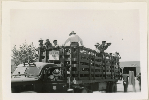 Cotton pickers waiting to leave (ddr-densho-37-948)