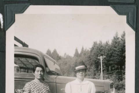 Photo of two women in front of a truck (ddr-densho-483-894)